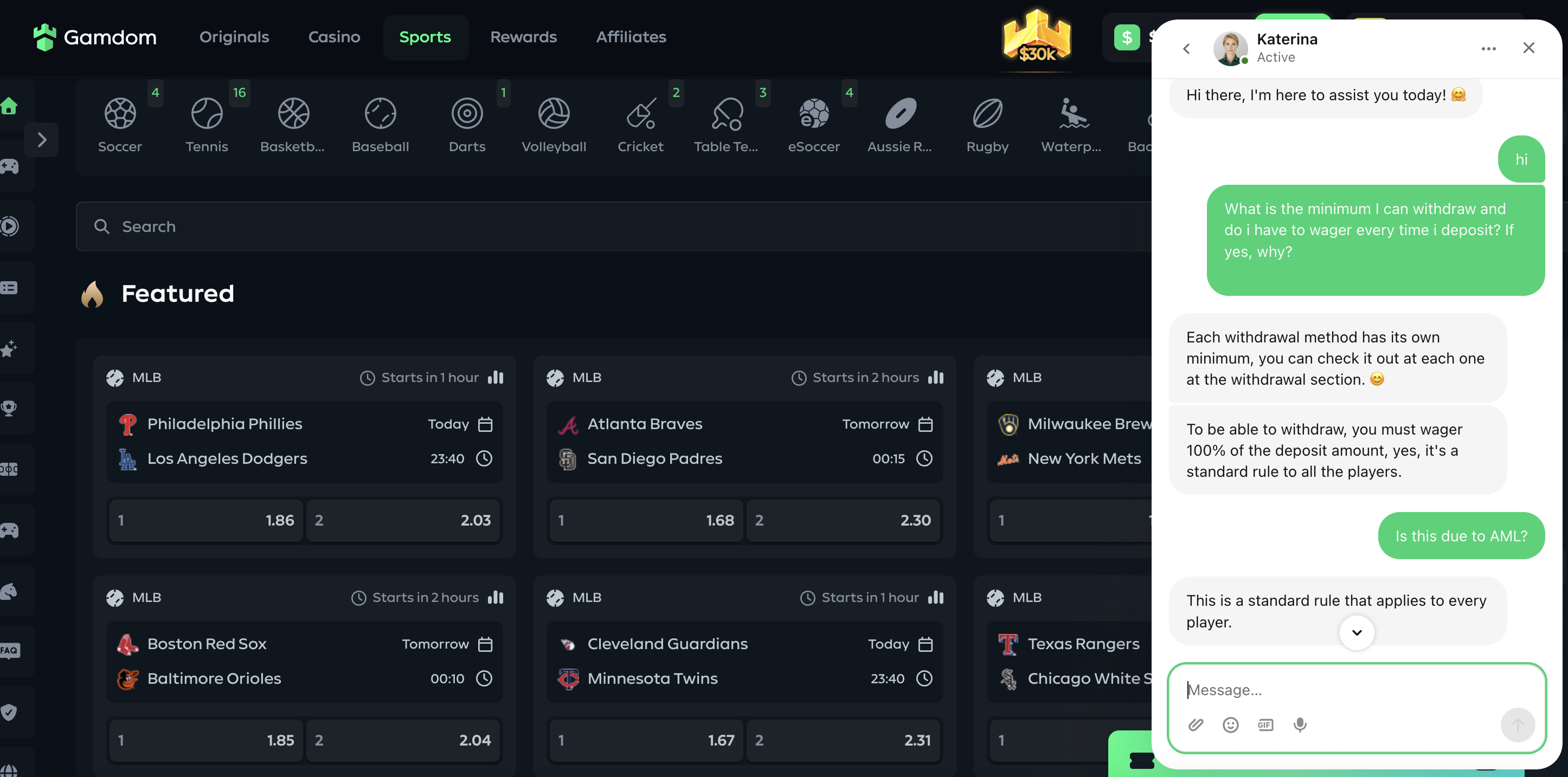 Gamdom live chat: CB asks whether the deposit must be wagered every time and why; agent Katerina replies that you must wager 100% of the deposit, a standard rule for all players; when CB asks if it is due to AML, the agent replies only that it is a standard rule that applies to every player